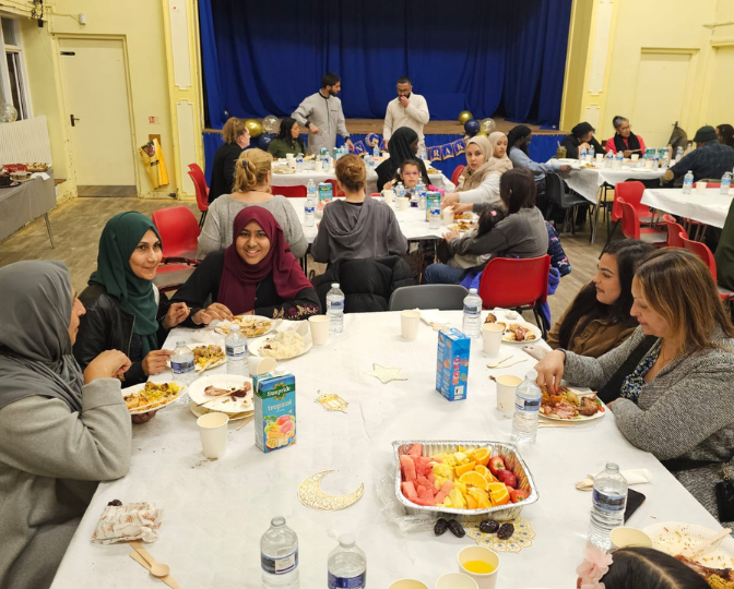 Community members tuck into tasty food at our young-people led community Iftar event