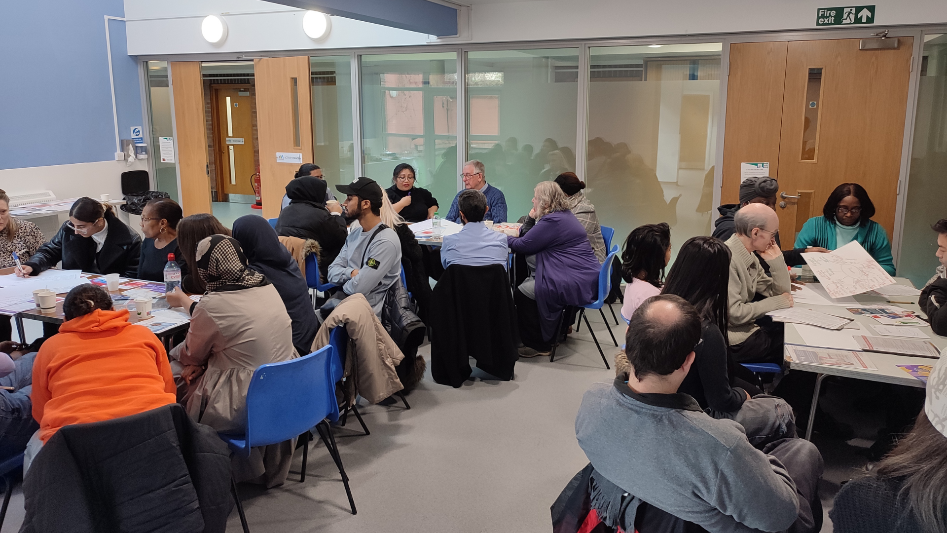 Staff and volunteers socialise in the Activity Space